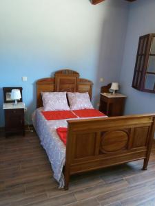 a bedroom with a wooden bed with two night stands at Casas de Canavezes in Marco de Canavezes