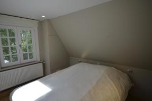 Giường trong phòng chung tại Vakantiewoning Wanderlust