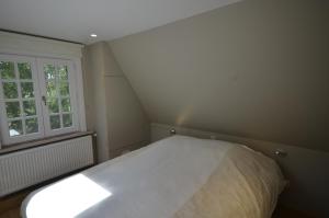 Postel nebo postele na pokoji v ubytování Vakantiewoning Wanderlust