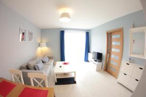 Telewizja i/lub zestaw kina domowego w obiekcie Apartament Kapitański Bursztynowe Komnaty
