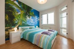 a bedroom with a palm tree mural on the wall at Sunrise Smart Home in Varna City
