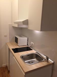 Kuchyň nebo kuchyňský kout v ubytování Apartment Stara vrata