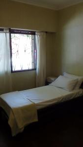 Un pat sau paturi într-o cameră la Casa con garage y patio - 6 personas - 26 y 45