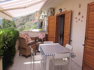 Un patio o zona al aire libre en Verde Taormina