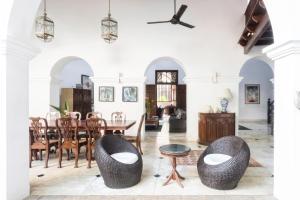 a dining room with a table and chairs at Number 48 Galle Fort in Galle