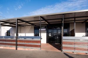 a building with an entrance to a parking lot at Mowbray Hotel in Launceston