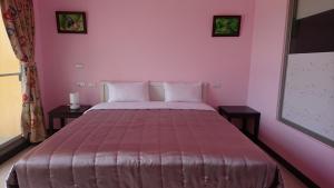 Letto o letti in una camera di Kuan Min B&B
