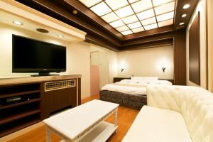 Postel nebo postele na pokoji v ubytování Hotel Luna (Adult Only)