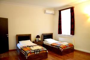 Postel nebo postele na pokoji v ubytování Hotel Canyon