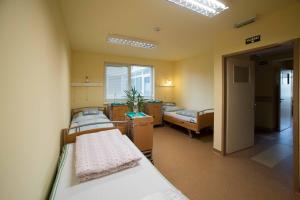 Posteľ alebo postele v izbe v ubytovaní Borbányai Rehabilitációs Ház