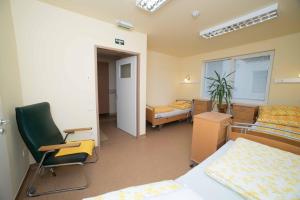 Posteľ alebo postele v izbe v ubytovaní Borbányai Rehabilitációs Ház