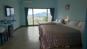 Letto o letti in una camera di Kuan Min B&B