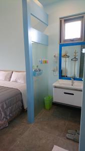 Letto o letti in una camera di Kuan Min B&B