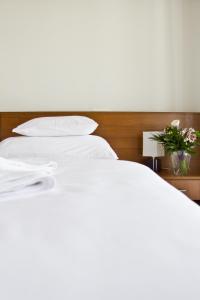 Postel nebo postele na pokoji v ubytování Hotel Kelep