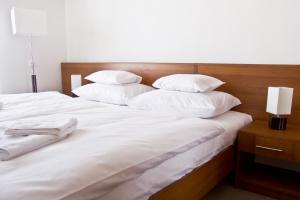 Postel nebo postele na pokoji v ubytování Hotel Kelep