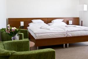 Postel nebo postele na pokoji v ubytování Hotel Kelep