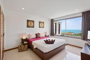 a bedroom with a bed with a view of the ocean at Tranquil Residence 3 - 2 Bedroom Apartment in Lamai +36 photos