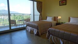 Letto o letti in una camera di Kuan Min B&B