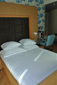 Postel nebo postele na pokoji v ubytování Amadi Park Hotel