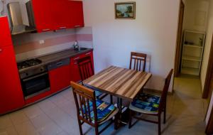 Kuchyň nebo kuchyňský kout v ubytování Apartments & Room Toni