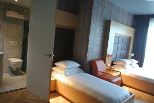 Postel nebo postele na pokoji v ubytování Amadi Park Hotel