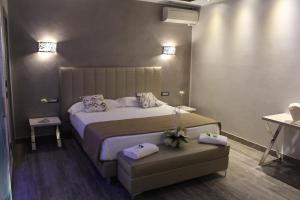 Postel nebo postele na pokoji v ubytování Hotel Aquila