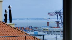 a view of the ocean from a balcony of a ship at Riverfront studio in Lisbon