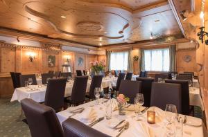 a conference room with tables and chairs and tablesktop at Salzano Basic Rooms Interlaken in Interlaken