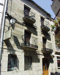 a building with balconies on the side of it at La Casa del Regidor in Fermoselle