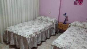 Posteľ alebo postele v izbe v ubytovaní Palmeral de Torrevieja