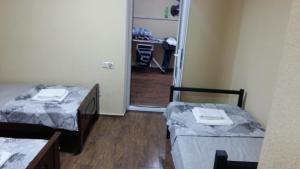 Postel nebo postele na pokoji v ubytování Guest House Kldiashvili