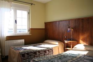 Giường trong phòng chung tại La Casona de Collado