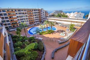 an aerial view of a resort with two pools at Balcon De Los Gigantes in Puerto de Santiago