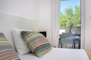 Postel nebo postele na pokoji v ubytování Royal Apartments