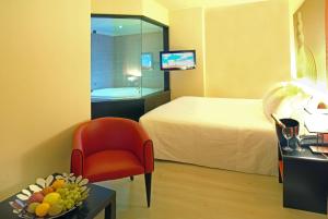 Amatì Design Green Hotel的电视和/或娱乐中心