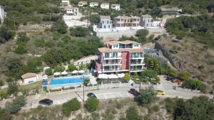 an aerial view of a building with a pool at Katerina Lefkada in Vasiliki