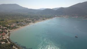 an aerial view of a beach with a boat in the water at Katerina Lefkada in Vasiliki