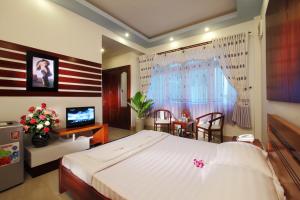 a bedroom with an american flag painted on the wall at Gold Stars Hotel in Long Hai