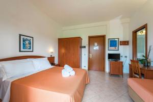 Postel nebo postele na pokoji v ubytování Albergo Villa A Mare