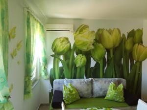 a room with a mural of flowers on the wall at Apartment Ksenija in Crikvenica