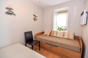 Ένα ή περισσότερα κρεβάτια σε δωμάτιο στο Nida Lotmiskio Apartamentas