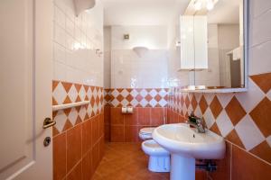 Koupelna v ubytování Hotel Villaggio Dei Pescatori + 37 fotografií