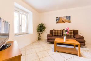 TV a/nebo společenská místnost v ubytování Apartments Gloria