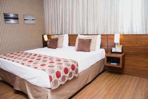 Cama ou camas em um quarto em Class Hotel Pouso Alegre