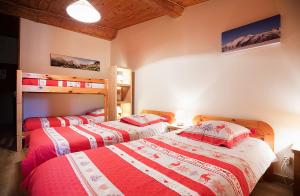 Postel nebo postele na pokoji v ubytování La Roche du Croue