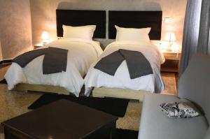 מיטה או מיטות בחדר ב-Point du Jour