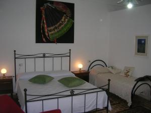 Casa vacanze Ex B&B La Bicocca - Via Umberto 15 tesisinde bir odada yatak veya yataklar