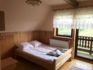 Łóżko lub łóżka w pokoju w obiekcie Dom Wypoczynkowy Grań
