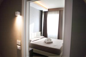 Posteľ alebo postele v izbe v ubytovaní Hotel Palazzo del Garda & Spa
