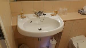 a white sink in a bathroom with a toilet at Agnes Blackadder Hall - Campus Accommodation in St. Andrews